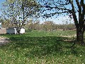 There's a shed and a wall (used for banging head up against, I guess) and about 1/2 acre of open space. As of mid-May, I'm still thinking about it.